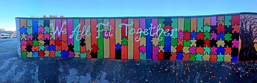 A wall with colorful puzzle pieces