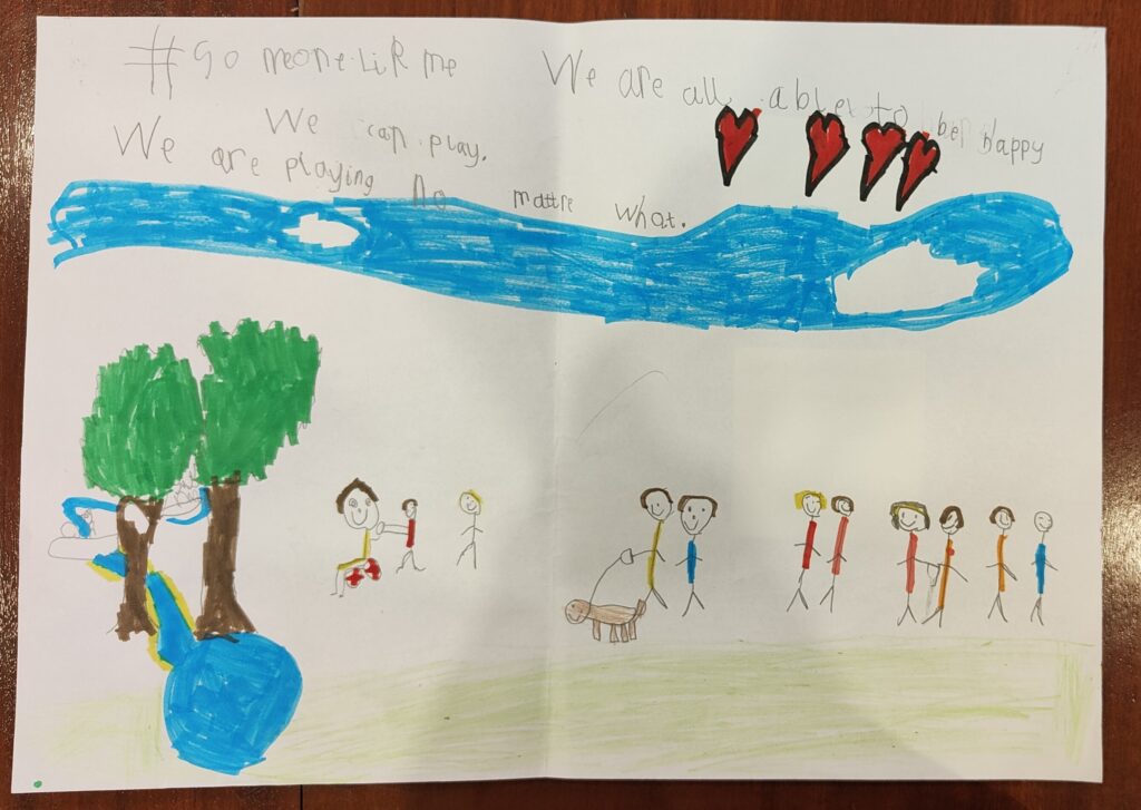 A piece of paper with a child's drawing of people and a landscape